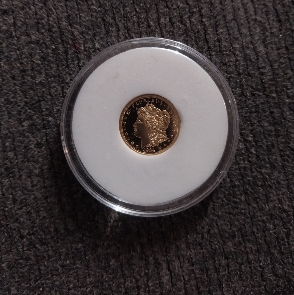 Solid gold copy $5 coin